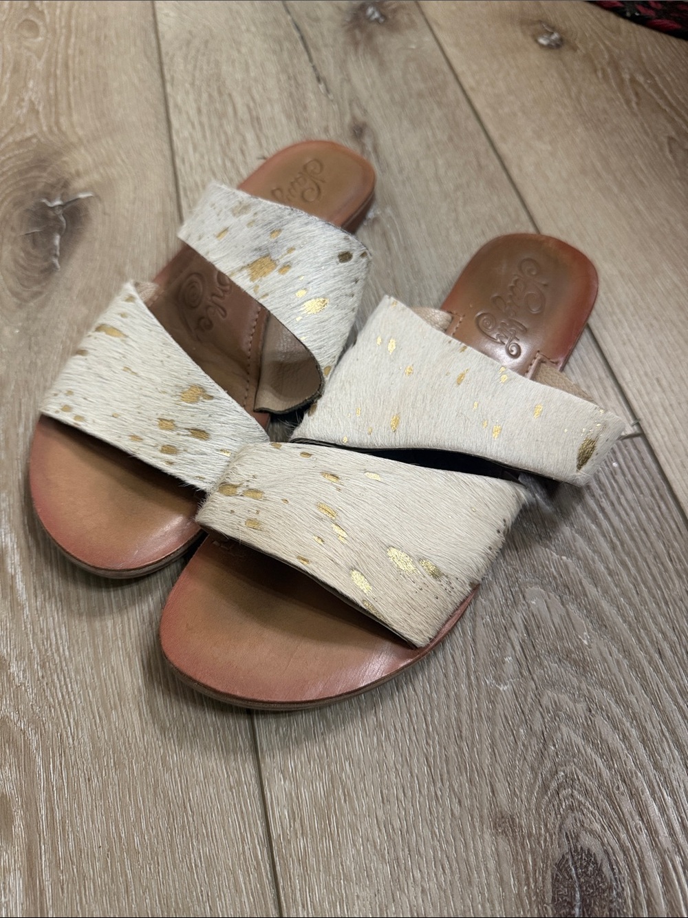 naughty monkey Cream Hair-On Cross-Strap Sandals with Gold Flecks